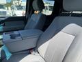 Interior view of a 2014 Ford F-150 showing front seats and a center console