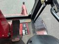 Close-up view of the interior controls and floor area of a 2012 Toro Groundsmaster 5910 showing pedals switches and warning labels