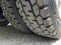 Close-up of the tread on a tire from a 2009 Ford F-550 showing deep grooves and textures designed for traction and stability