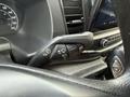 A close-up view of the steering column controls in a 2022 Ford Transit featuring buttons for wipers and various other functions