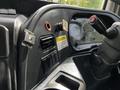 Interior dashboard of a 2012 Autocar Xpert featuring control panels knobs and warning labels