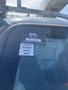 2009 Ford Econoline with a certificate of approval sticker displayed on the windshield indicating calendar months and other information