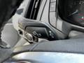 Close-up of the turn signal and headlight control lever on a 2015 Ford Transit