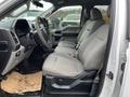 2016 Ford F-150 interior featuring gray fabric seats and a steering wheel with controls
