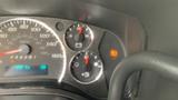 Dashboard of a 2017 Chevrolet Express Quigley 4x4 showing speedometer fuel gauge and warning lights