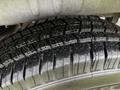 A close-up of a treaded tire on a 2021 Mercedes-Benz Sprinter showcasing deep grooves and patterns for traction