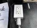 A white electrical outlet box installed in the interior of a 2018 Ford F-550