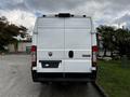 A 2019 RAM Promaster van in white with the rear doors closed and a RAM logo visible on the back