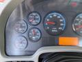 Dashboard of a 2008 International 7500 displaying various gauges for temperature, pressure, RPM, and an odometer reading