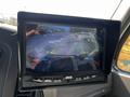 A display screen showing a rear view camera feed with parking guidelines and obstacles highlighted in different colors
