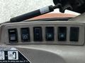 Controls and switches on a 2011 Kubota M8540D tractor dashboard featuring six black switches with various icons for different functions
