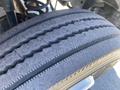 Close-up of a worn tire from a 2015 Ford F-450 SD showing visible tread wear and grooves on the surface