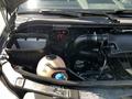2017 Mercedes-Benz Sprinter engine compartment showing components like the air filter battery and fluid reservoirs