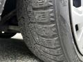 Close-up of a worn tire on a 2019 Ford Transit Connect showing tread patterns and grooves