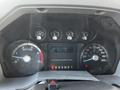 Dashboard of a 2011 Ford F-450 SD showing gauges for speed, RPM, fuel, and engine hours with a digital display in the center