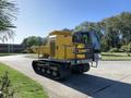 A yellow 2022 TerraMac Tracked Dump with a distinctive cab design and wide tracks for stability on uneven terrain