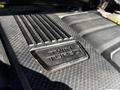 Close-up of the engine cover of a 2023 Toyota Tundra featuring the words Twin Turbo embossed on a textured surface