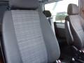 Interior of a 2016 Mercedes-Benz Sprinter showing two black fabric seats with a checkered pattern
