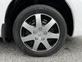 A close-up of a black alloy wheel on a 2020 Nissan NV200 showcasing five spokes and a Kumho tire