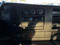 Dashboard of a 2017 Chevrolet Express featuring climate controls audio system and various switches and knobs