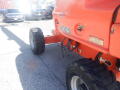A 2008 JLG Boom Lift with large rubber tires and an orange chassis featuring a model number 400S on the side