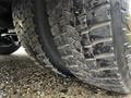 Close-up of a worn tire from a 2017 Chevrolet Express highlighting the tread and sidewall details