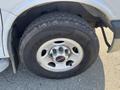 Close-up of a 2016 GMC Savana tire with the Goodyear Wrangler label visible and a silver alloy wheel featuring the GMC logo