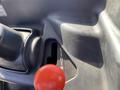 The gear shift lever of a 2018 Kubota RTV-X 1100 C showing positions for low high and neutral with a red knob