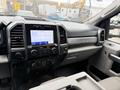 Interior view of a 2020 Ford F-550 showing the dashboard with touchscreen display controls and the Super Duty label