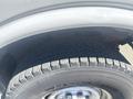 Close-up of a tire from a 2007 Chevrolet Express showing detailed tread design and wheel rim