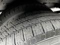 Close-up of two tires from a 2017 Ford Transit 350 showing detailed tread pattern and rubber texture