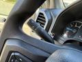 Close-up of the steering column in a 2018 Ford F-150 showing the windshield wiper control and part of the dashboard with gauges