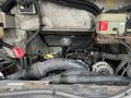 A 2012 Workhorse W62 engine compartment showing various components including wiring hoses and a gear shifter