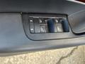 Window control panel of a 2006 Audi A6 featuring buttons for controlling the windows and locks