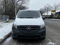 A 2019 Mercedes-Benz Metris van with a silver exterior covered in light snow faces directly toward the viewer showcasing the iconic three-point star emblem on the grille