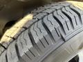 Close-up of the tire tread on a 2018 Chevrolet Express showing deep grooves and patterns for traction