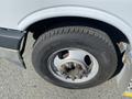 A close-up of the tire and wheel of a 2017 Chevrolet Express showing the tread pattern and lug nuts