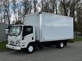A white 2022 Isuzu NPR box truck with a large cargo area and no visible logos on the side