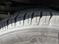 Close-up of a 2017 Chevrolet Express tire showing tread patterns and visible wear including a noticeable crack on the sidewall