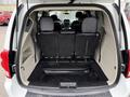 Interior view of a 2017 Dodge Grand Caravan showing the back seats folded down for cargo space