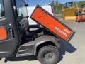 A 2018 Kubota RTV-X 1100 C utility vehicle with a raised cargo bed displaying the Kubota logo and diesel designation on the side