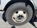 Close-up of a tire mounted on a 2007 Freightliner M2 106 showing the wheel rim and lug nuts