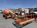 A 2008 JLG Boom Lift featuring a large orange platform with safety rails and controls for operation positioned for use on a construction site