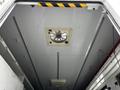 View of the ceiling inside a 2013 Ford Econoline featuring a ventilation fan and metal support beams
