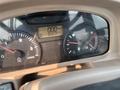 Dashboard of a 2010 Kubota M6040 showing gauges for speed engine RPM fuel level and hour meter reading 95977 hours