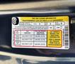 A 2015 Ford F-150 tire and loading information label with details on seating capacity tire sizes and recommended tire pressure