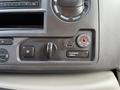 Dashboard controls of a 2022 Ford E-450 featuring buttons for traction control and airbag settings along with a USB port and a radio display