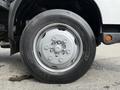 Close-up of a silver wheel from a 2018 Hino 195 truck showing the tire tread and rim design