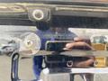 A 2015 Kia Sorento's rear camera lens mounted on the vehicle's rear hatch with reflections visible on the surface