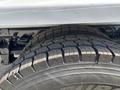 A close-up view of a large tire on a 2016 Ford F-750 showing deep treads and sturdy construction